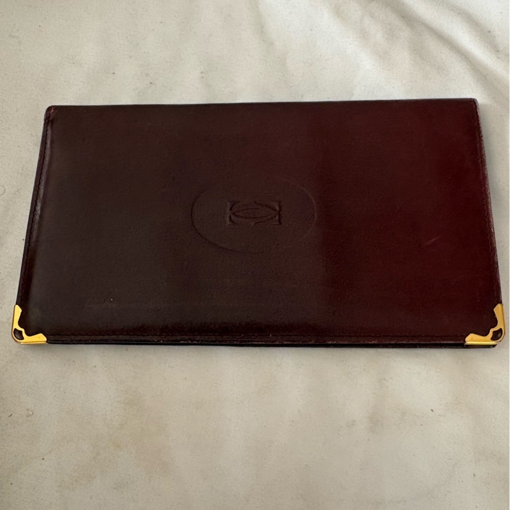 Cartier Bordeaux Leather Bifold Wallet with Gold Corner Accents